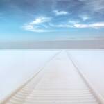 snow covered dock on a frozen Canadian lake